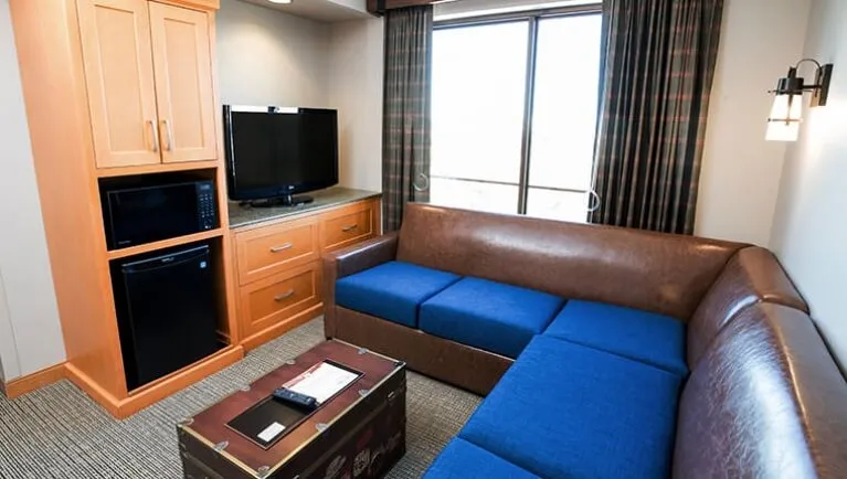 The living area and couch in the accessible Grizzly Family Suite  (Accessible bathtub)